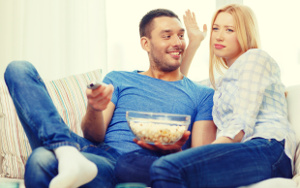 He insists on popcorn & the remote if he has to watch a rom com